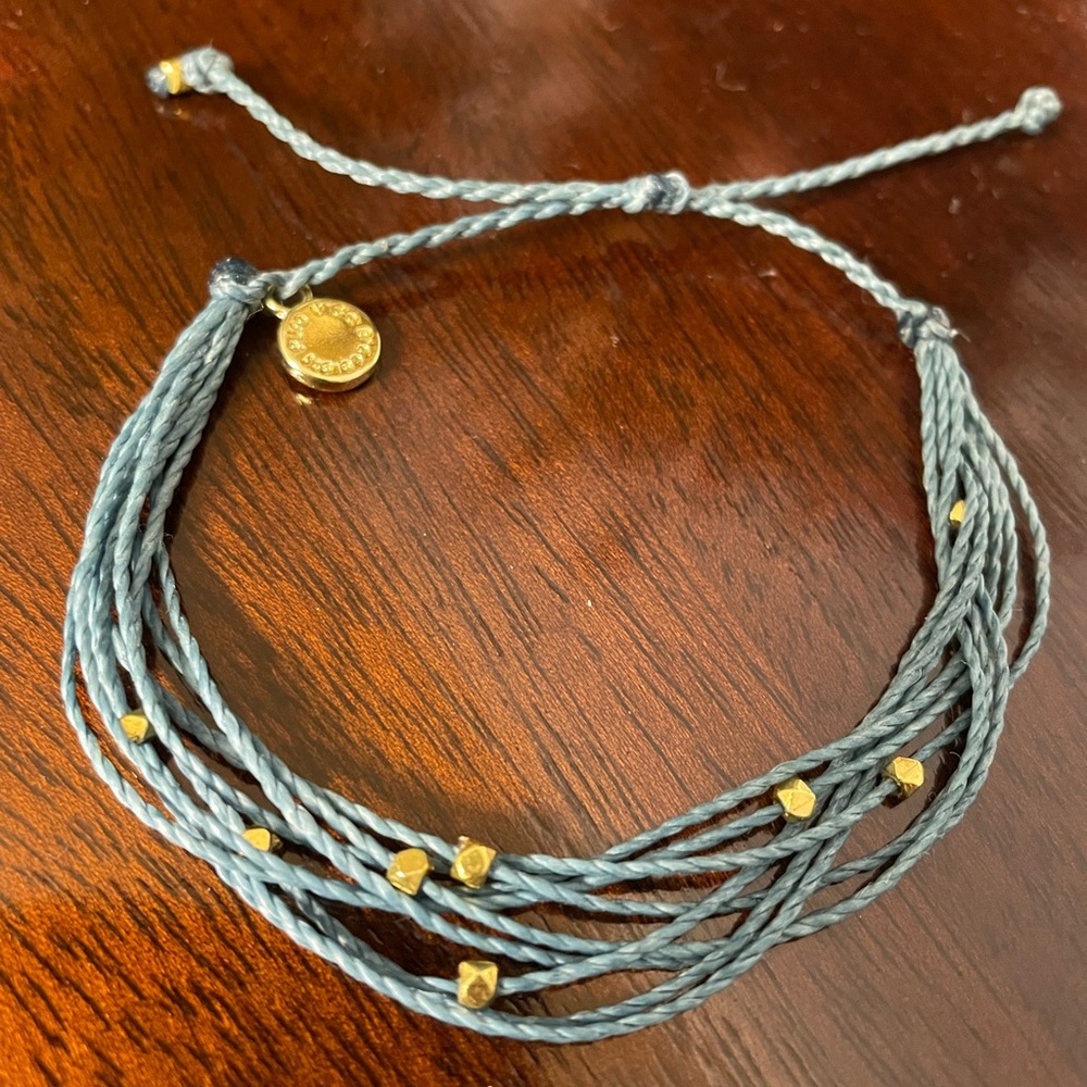 Pura Vida medium blue multi-strand bracelet with gold-tone bead accents